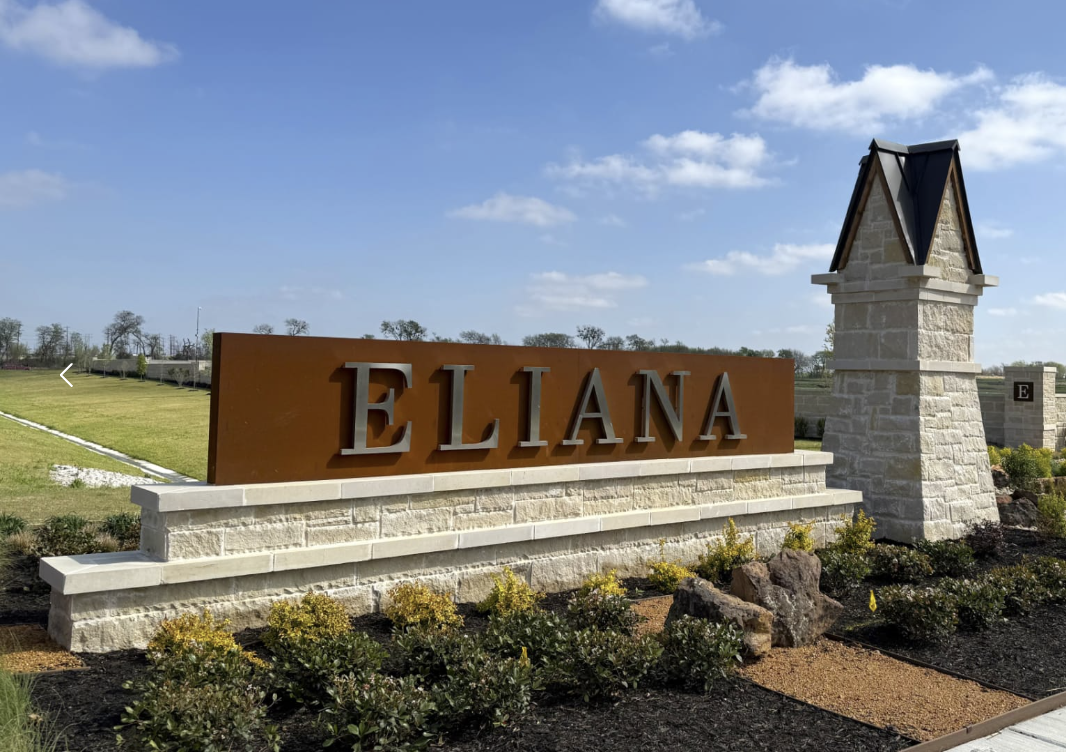 Eliana community entrance sign in McKinney, Texas, with stone pillars and landscaping